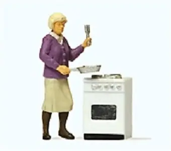 Kobieta przy kuchence