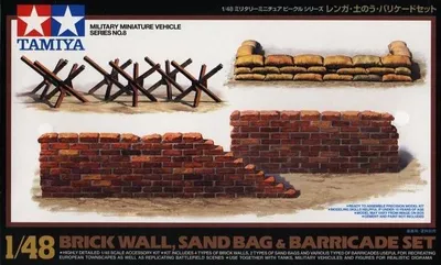 Zestaw barykad, mur z cegieł, worki z piaskiem