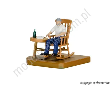 Mężczyzna w bujanym fotelu, figurka ruchoma