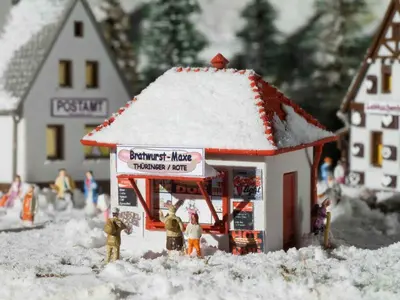 Imbis Bratwurst-Maxe ze sztucznym śniegiem